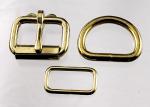 Two one inch brass plated roller buckles, two belt keepers, and two D rings