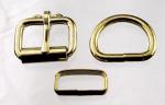 Two one inch brass plated roller buckles, two deluxe> belt keepers, and two D rings