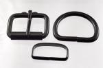 Two 1 1/2 inch black plated roller buckles, two <I>deluxe</I> belt keepers, and two D rings