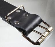 A double tongue heel bar roller buckle.