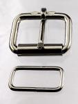 Two 1 1/4 inch nickel plated roller buckles and two belt keepers